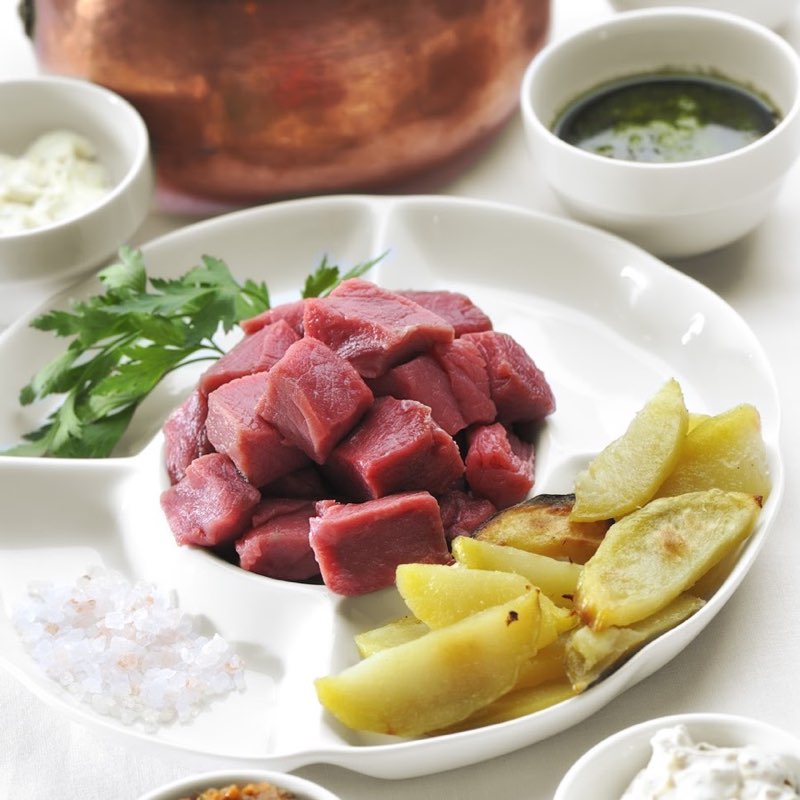 Fondue Bourguignonne with diced meat